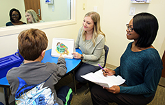 Staff working with patient