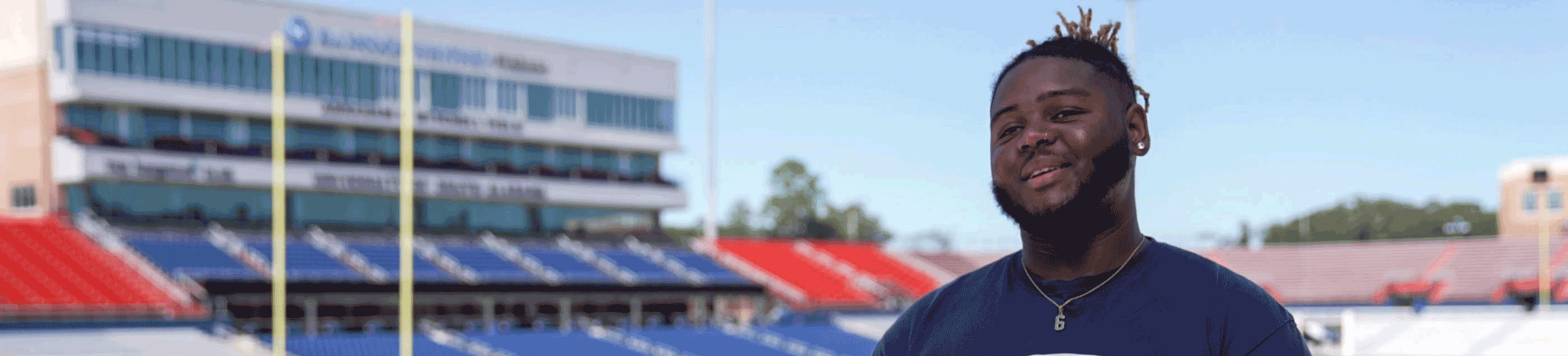 Communication student on South's football field.