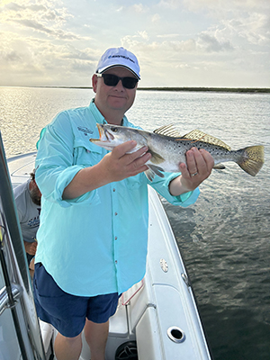 Dr. Sean Powers holding fish