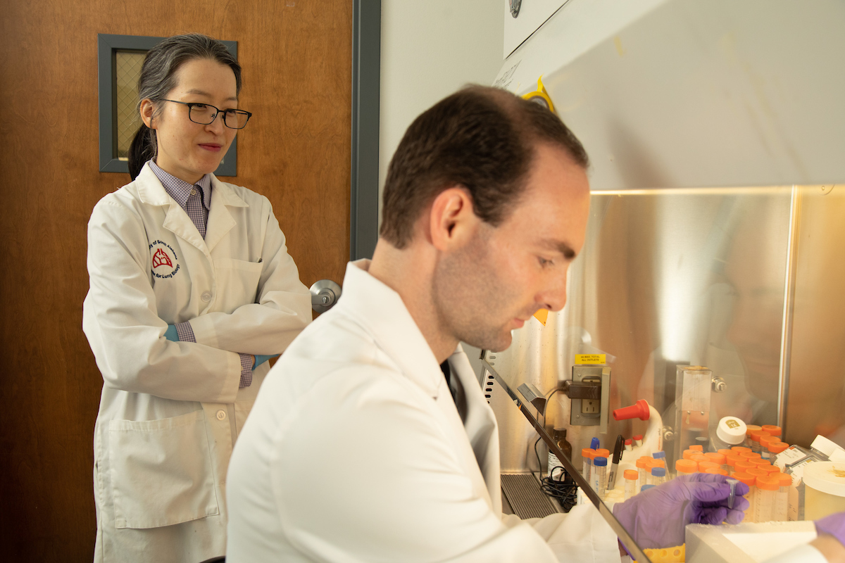 Photo of BMS student Reece Stevens and Dr. Lee in the lab