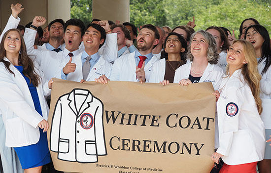 Group at white coat ceremony.