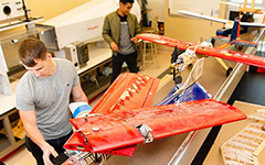 Students working on drone plane.