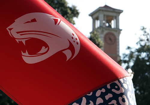 Jag logo in front of Moulton Tower.