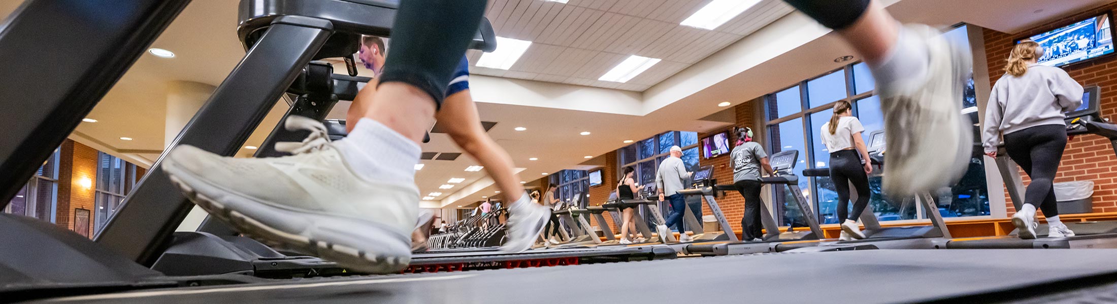 Tennis shoes on treadmills.