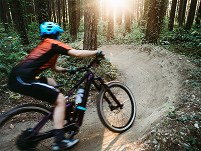 Student riding bike on USA bike trail.