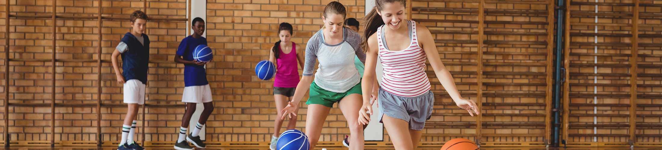 Group of kids playing basketball.