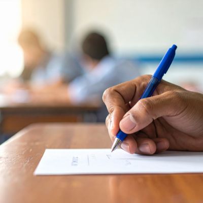 Pen writing on paper.