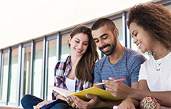 Three students talking sitting