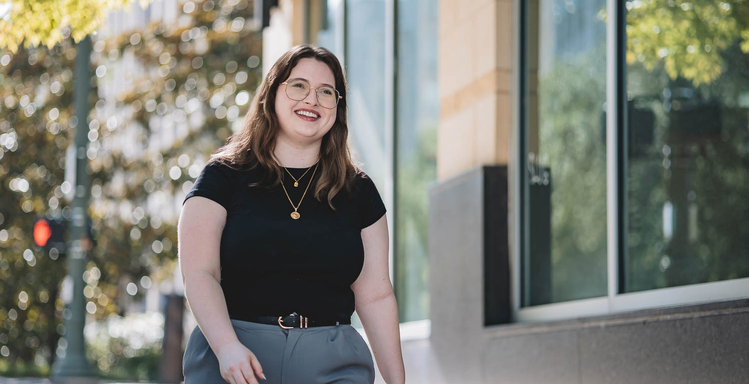 University of South Alabama graduate Campbell Harper walking outside the IBM office in downtown Baton Rouge, Louisiana, where she works. 