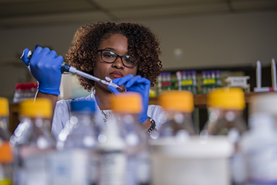 Female working in lab.