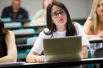 Student working on laptop.